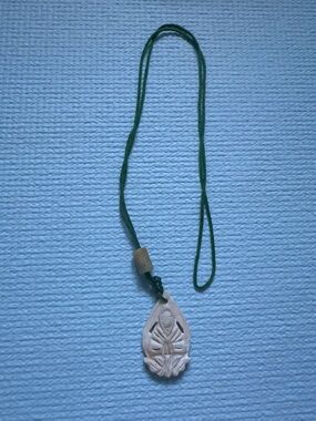 Handcrafted Cream Buddhist Pendant Necklace with Green Cord